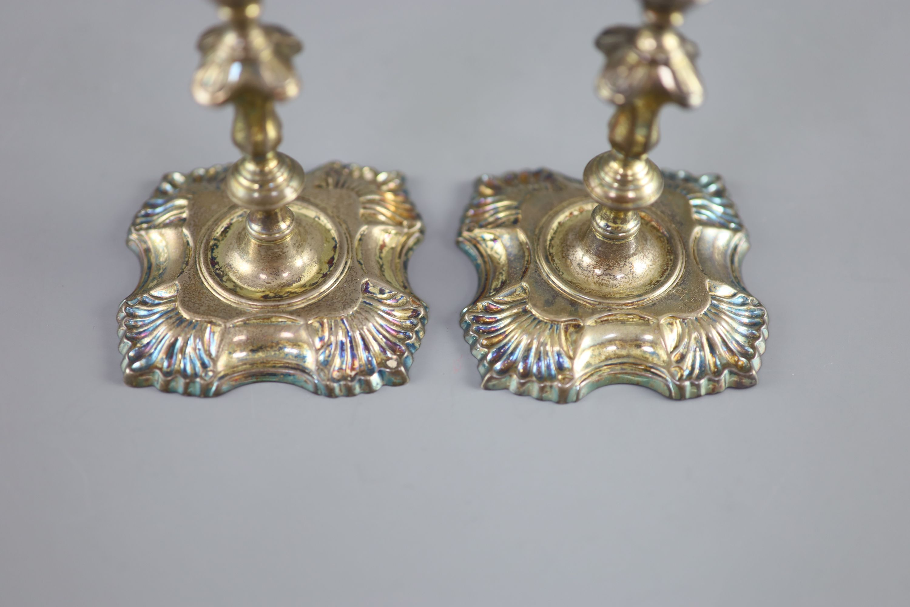 A pair of George II cast silver tapersticks, by Richard Gurney & Co